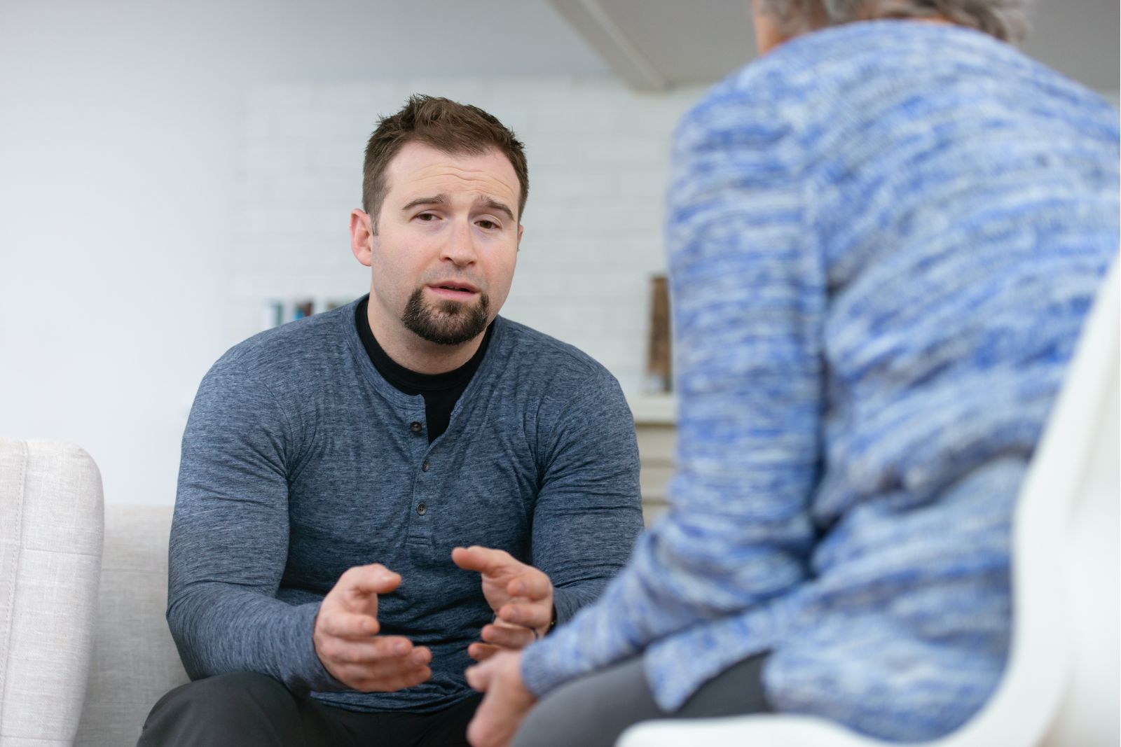 Man talking to therapist